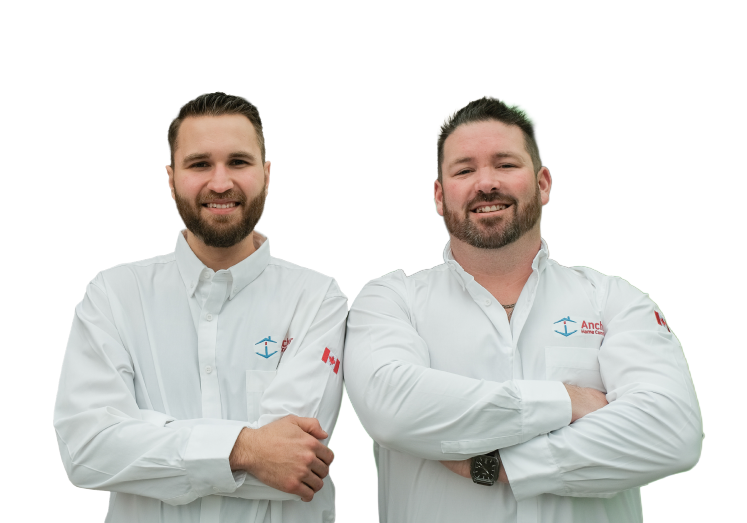 Two Anchor Home Comfort technicians smiling in front of their green service van, wearing issued jackets during an on-site consultation.